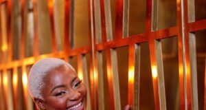 How to Dress for Yourself and Feel Confident at Any Size: Plus Size Style Tips That Truly Fit Confident woman in red dress How to Dress for Yourself and Feel Confident at Any Size: Plus Size Style Tips That Truly Fitwith a radiant smile indoors.