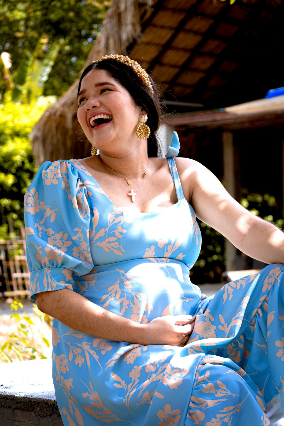 woman in blue and white floral spaghetti strap dress