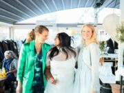 Three How to Practice Body Positivity When You’re Plus Size: Confidence Tips for Every Outfit smiling and talking at an outdoor event